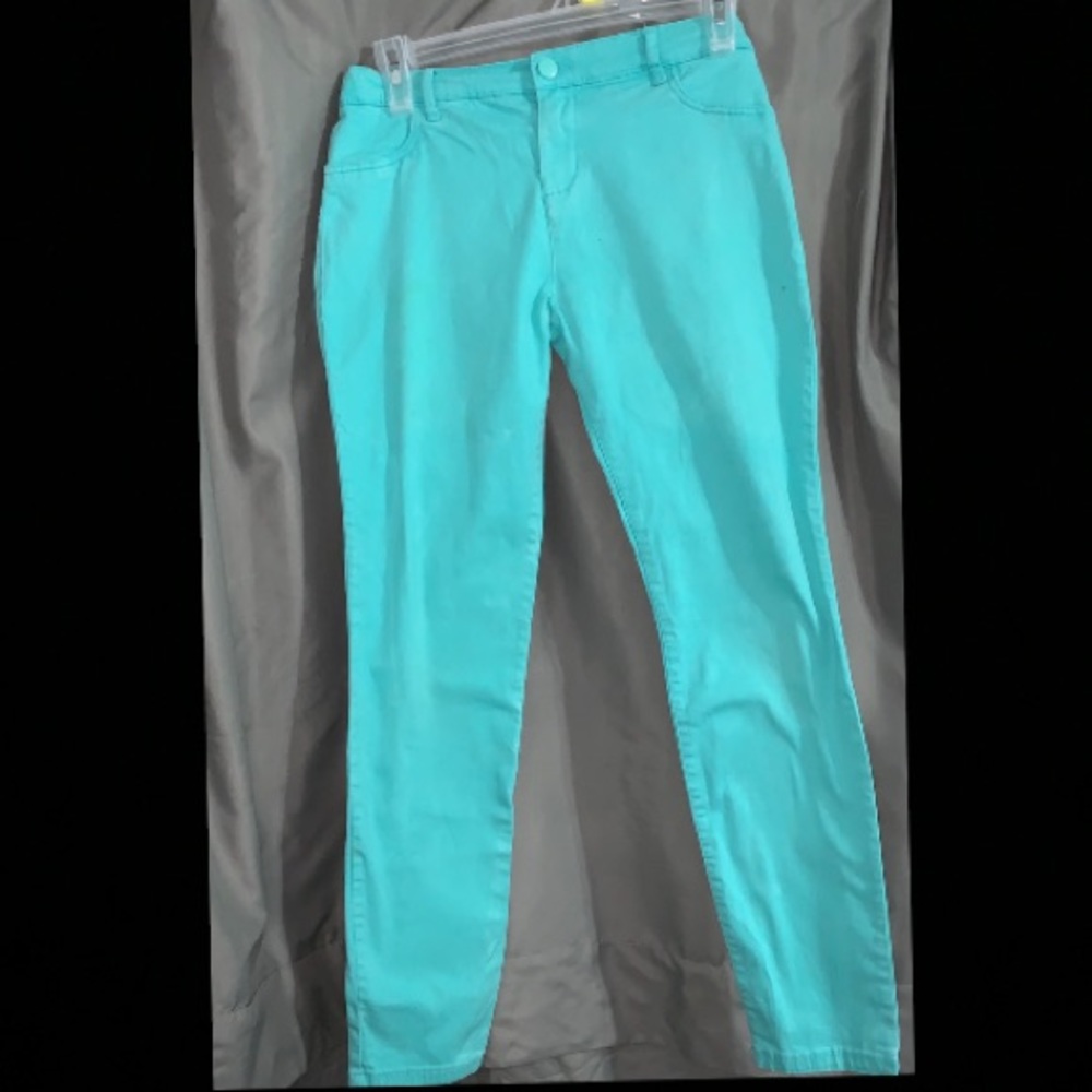 Turquoise jeans.